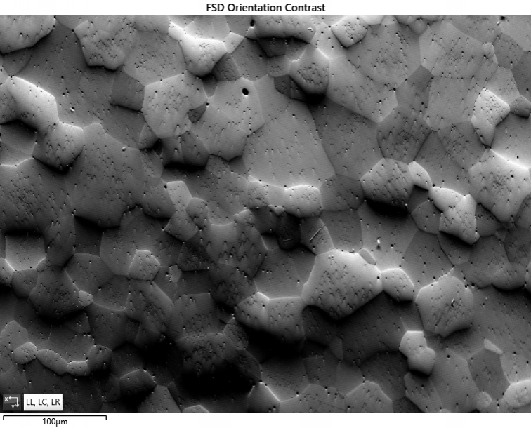 Orientation contrast image (FSD) from an uncoated Zirconia sample. Charging is not visible in the signal levels but can lead to distortions in the image.Orientation contrast image (FSD) from an uncoated Zirconia sample. Charging is not visible in the signal levels but can lead to distortions in the image.